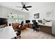 Spacious office with multiple workstations, a comfortable leather sofa, and natural light at 2377 Emory Ln, Marietta, GA 30068