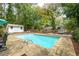 Backyard pool with sundeck, lounge seating and ladder at 2377 Emory Ln, Marietta, GA 30068