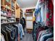 Walk-in closet with wooden shelving and rods for ample clothing and shoe storage at 2377 Emory Ln, Marietta, GA 30068