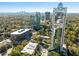 Panoramic view of a tall high-rise, set amongst other buildings and trees at 2828 Peachtree Nw Rd # 1502, Atlanta, GA 30305