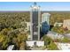 Stunning aerial perspective of a high-rise nestled amidst lush trees and cityscape views at 2828 Peachtree Nw Rd # 1502, Atlanta, GA 30305