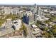 Wide aerial shot featuring a high-rise in an urban setting surrounded by trees and roadways at 2828 Peachtree Nw Rd # 1502, Atlanta, GA 30305