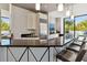 Sleek bar area with modern stools, countertops, and stainless-steel fridge at 2828 Peachtree Nw Rd # 1502, Atlanta, GA 30305