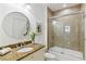 Bathroom featuring a granite vanity, shower-tub, and decorative mirror providing a serene retreat at 2828 Peachtree Nw Rd # 1502, Atlanta, GA 30305