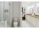 Modern bathroom with dual sinks, a walk-in shower, and a neutral palette with bedroom access at 2828 Peachtree Nw Rd # 1502, Atlanta, GA 30305