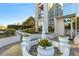 Serene courtyard featuring a water fountain, lush plants, and manicured landscaping at 2828 Peachtree Nw Rd # 1502, Atlanta, GA 30305