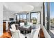 Open dining and living space featuring floor-to-ceiling windows with stunning views at 2828 Peachtree Nw Rd # 1502, Atlanta, GA 30305