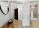 Well-lit condo foyer with a decorative mirror and access to a bathroom at 2828 Peachtree Nw Rd # 1502, Atlanta, GA 30305