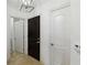 Condo foyer featuring tile floors and a dark wood door at 2828 Peachtree Nw Rd # 1502, Atlanta, GA 30305