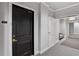 Hallway with neutral walls, carpet, and trim leading to unit 1502 at 2828 Peachtree Nw Rd # 1502, Atlanta, GA 30305