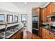 The gourmet kitchen boasts wood cabinetry, black countertops, and stainless appliances at 2828 Peachtree Nw Rd # 1502, Atlanta, GA 30305