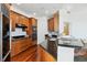 Kitchen featuring stainless steel appliances, granite countertops, and wood flooring at 2828 Peachtree Nw Rd # 1502, Atlanta, GA 30305