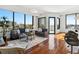 Spacious living room with hardwood floors and floor-to-ceiling windows showcasing city views at 2828 Peachtree Nw Rd # 1502, Atlanta, GA 30305