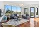 Bright living room with large windows offering city views and hardwood floors at 2828 Peachtree Nw Rd # 1502, Atlanta, GA 30305