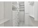 Well-organized walk-in closet featuring custom shelving, drawers, and ample storage space at 2828 Peachtree Nw Rd # 1502, Atlanta, GA 30305