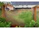 Aerial view of the expansive and fenced backyard, complete with a deck and lush green lawn at 4040 Brightmore Dr, Austell, GA 30106