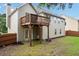 The home features a wooden deck overlooking a private, grassy backyard, ideal for outdoor activities at 4040 Brightmore Dr, Austell, GA 30106
