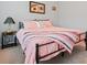Bedroom featuring carpet, a metal frame bed, and ample natural light at 4040 Brightmore Dr, Austell, GA 30106