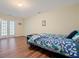 A cozy bedroom with hardwood floors, natural light, and simple decor at 4040 Brightmore Dr, Austell, GA 30106