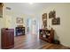 Hallway leading to other rooms, featuring hardwood floors and decorative shelves at 4040 Brightmore Dr, Austell, GA 30106
