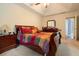 Main bedroom with natural light and a trey ceiling, cozy bed, and a dresser at 4040 Brightmore Dr, Austell, GA 30106