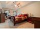 Spacious main bedroom with a ceiling fan, trey ceiling, and a comfortable bed at 4040 Brightmore Dr, Austell, GA 30106
