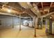 View of the unfinished basement, laundry area, and utility connections, perfect for storage at 1558 Boulderwoods Se Dr, Atlanta, GA 30316