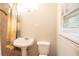 Bathroom featuring a pedestal sink, shower and good natural light at 1558 Boulderwoods Se Dr, Atlanta, GA 30316