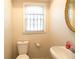 Bathroom showcasing a vintage sink and ornate window at 1558 Boulderwoods Se Dr, Atlanta, GA 30316