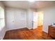 Bedroom featuring hardwood floors, neutral walls, and ample natural light from the window at 1558 Boulderwoods Se Dr, Atlanta, GA 30316