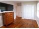 Bedroom with vintage wood dresser and closet at 1558 Boulderwoods Se Dr, Atlanta, GA 30316