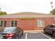 Wells Fargo branch building featuring brick facade, symmetrical windows, and well-maintained landscaping at 1558 Boulderwoods Se Dr, Atlanta, GA 30316