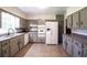 Spacious kitchen featuring painted cabinets, neutral countertops, and updated appliances at 1558 Boulderwoods Se Dr, Atlanta, GA 30316