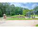 Community playground with slides, climbing structures, and shaded areas at 1558 Boulderwoods Se Dr, Atlanta, GA 30316