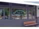 Window view of the Poor Hendrix Bar and Restaurant sign with a bench in front at 1558 Boulderwoods Se Dr, Atlanta, GA 30316
