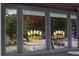 Window view of Gene's Cocktails and Hot Plates signs, reflecting the outside street at 1558 Boulderwoods Se Dr, Atlanta, GA 30316