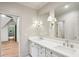 Bathroom featuring double sinks, marble countertops, and modern fixtures at 298 Saint Marys Nw Ln, Marietta, GA 30064