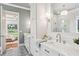 Bathroom featuring white cabinets, marble countertops, and a glass-enclosed shower, connecting to the main bedroom at 298 Saint Marys Nw Ln, Marietta, GA 30064