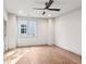 Bright bedroom featuring hardwood floors, white walls, and a ceiling fan at 298 Saint Marys Nw Ln, Marietta, GA 30064
