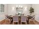 Formal dining room featuring wainscoting, modern chandelier, and seating for six at 298 Saint Marys Nw Ln, Marietta, GA 30064
