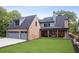 New construction showing side and rear exterior of the home with spacious yard at 298 Saint Marys Nw Ln, Marietta, GA 30064