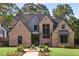 Charming brick home featuring a sophisticated modern design and manicured front lawn at 298 Saint Marys Nw Ln, Marietta, GA 30064