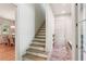 Hallway leading to staircase, dining room, and doorway to outdoor area at 298 Saint Marys Nw Ln, Marietta, GA 30064
