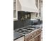 Gourmet kitchen featuring stainless steel appliances, pot filler, and custom cabinetry at 298 Saint Marys Nw Ln, Marietta, GA 30064