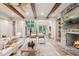 Elegant living room featuring a stone fireplace, high ceilings, and access to a grand foyer at 298 Saint Marys Nw Ln, Marietta, GA 30064