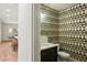Powder room featuring dark vanity, designer wallpaper, and neutral paint at 298 Saint Marys Nw Ln, Marietta, GA 30064