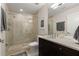 Modern bathroom with glass shower, neutral walls, and dark cabinets at 3325 Piedmont Ne Rd # 2006, Atlanta, GA 30305