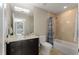 Neutral bathroom with tub and shower combination, sink, and large mirror at 3325 Piedmont Ne Rd # 2006, Atlanta, GA 30305