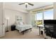 Bedroom with a ceiling fan, desk, and balcony overlooking the city at 3325 Piedmont Ne Rd # 2006, Atlanta, GA 30305