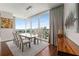 Bright dining area with a modern table, comfortable seating, and floor-to-ceiling windows with city views at 3325 Piedmont Ne Rd # 2006, Atlanta, GA 30305